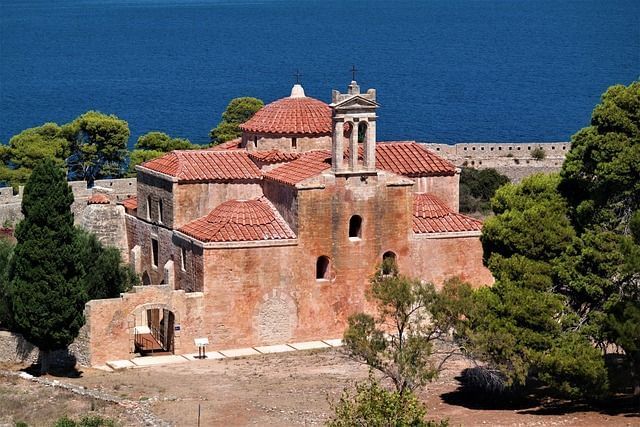 Photo of a church in front of the sea at Pylos.