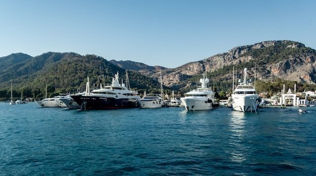 Boats on a shore at the foot of hills